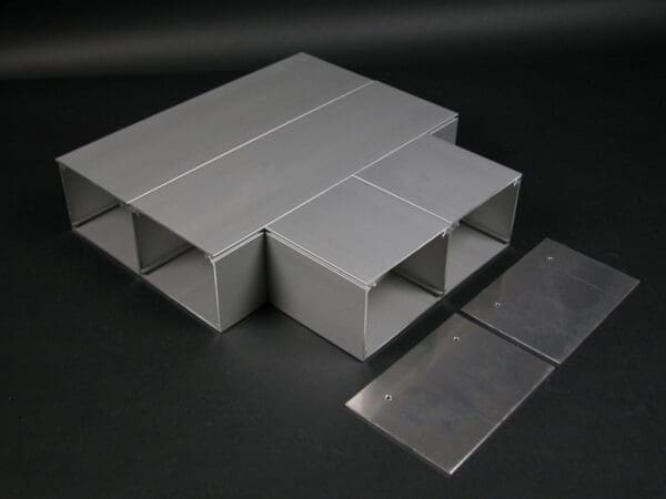 Aluminum cable trunking with end plates.