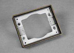Here's a short alt tag for the image: Bronze rectangular electrical box mounting plate.