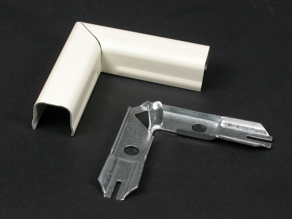 White and metal corner molding pieces.