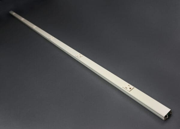 Long power strip with multiple outlets.