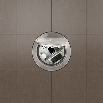 Here's an alt tag for the image: Floor-mounted power outlet, open.
