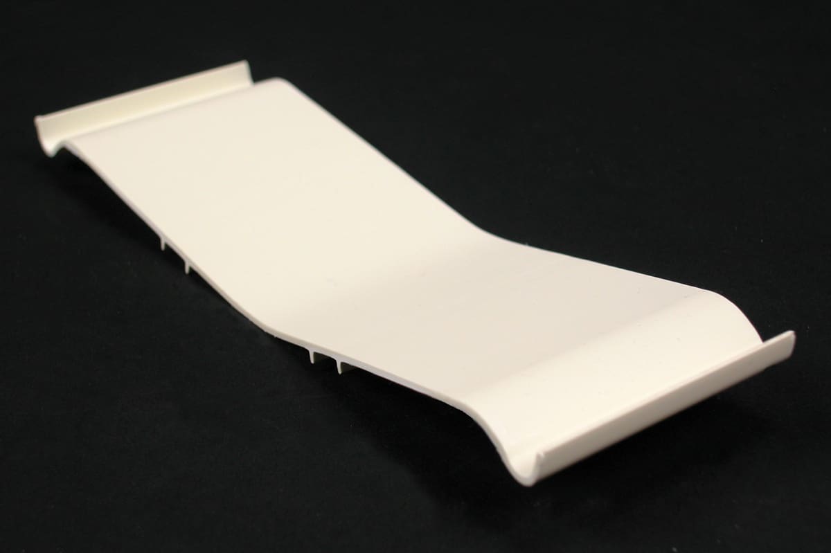 Off-white plastic window trim piece.