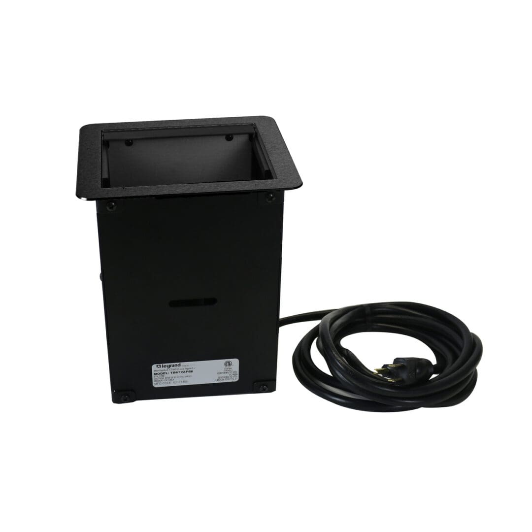 Black Legrand power outlet floor box.