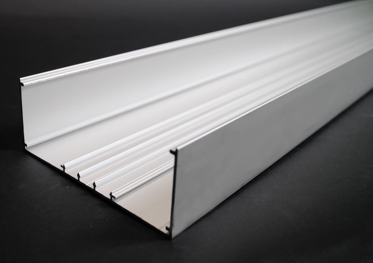 Here's an 8-word alt tag for the image: White aluminum channel, long, rectangular, with internal dividers.