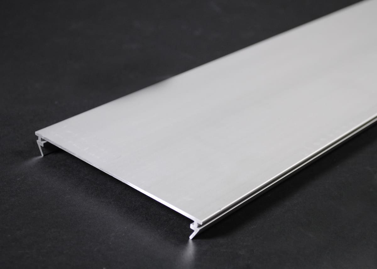 Here's an 8-word alt tag for the image: Aluminum extrusion, long rectangular shape, flat surface.