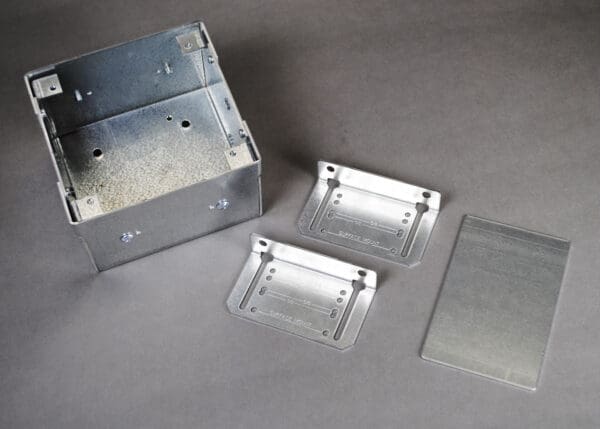 Metal box with surface mount brackets.