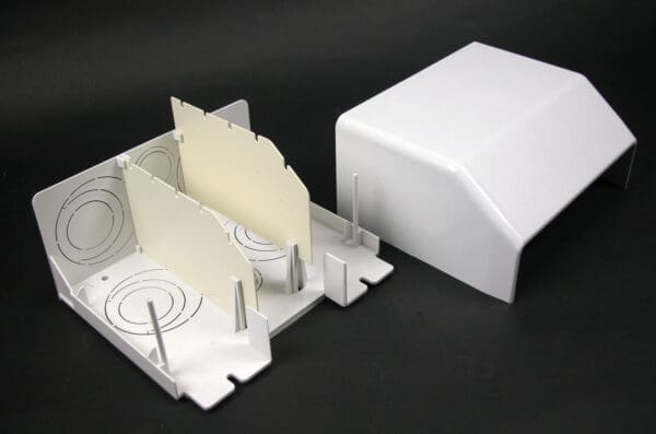 White plastic electrical box with cover.