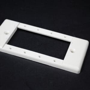 White double-gang electrical wall plate with screws.