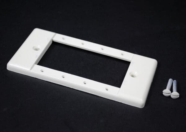 White double-gang electrical wall plate with screws.