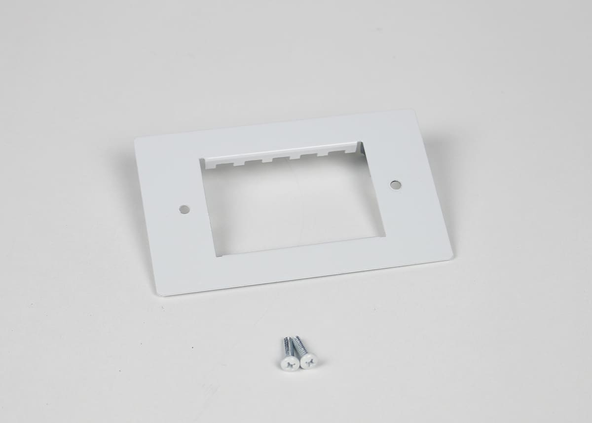 White blank wall plate with screws.