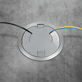 Here's an alt tag for the image: Floor cable access cover.