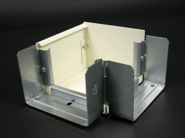 Here's an alt tag for the image: Metal and plastic electrical box enclosure.
