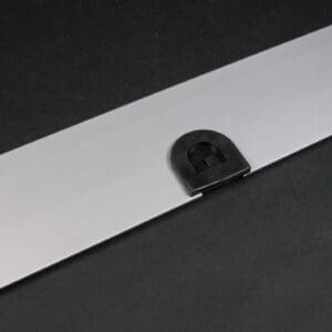 Silver metal plate with black latch.