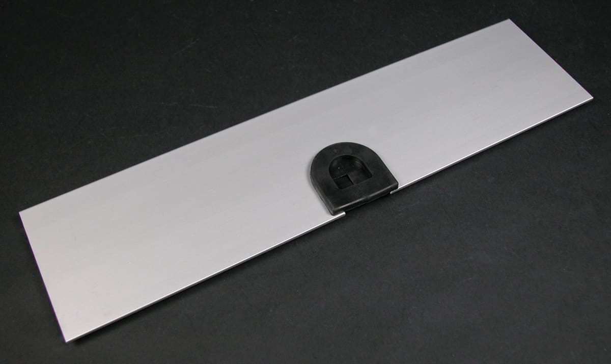 Silver metal plate with black latch.