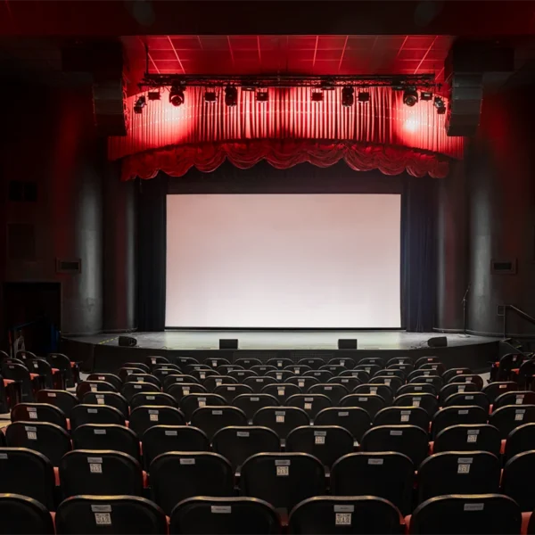 Empty theater with large screen.