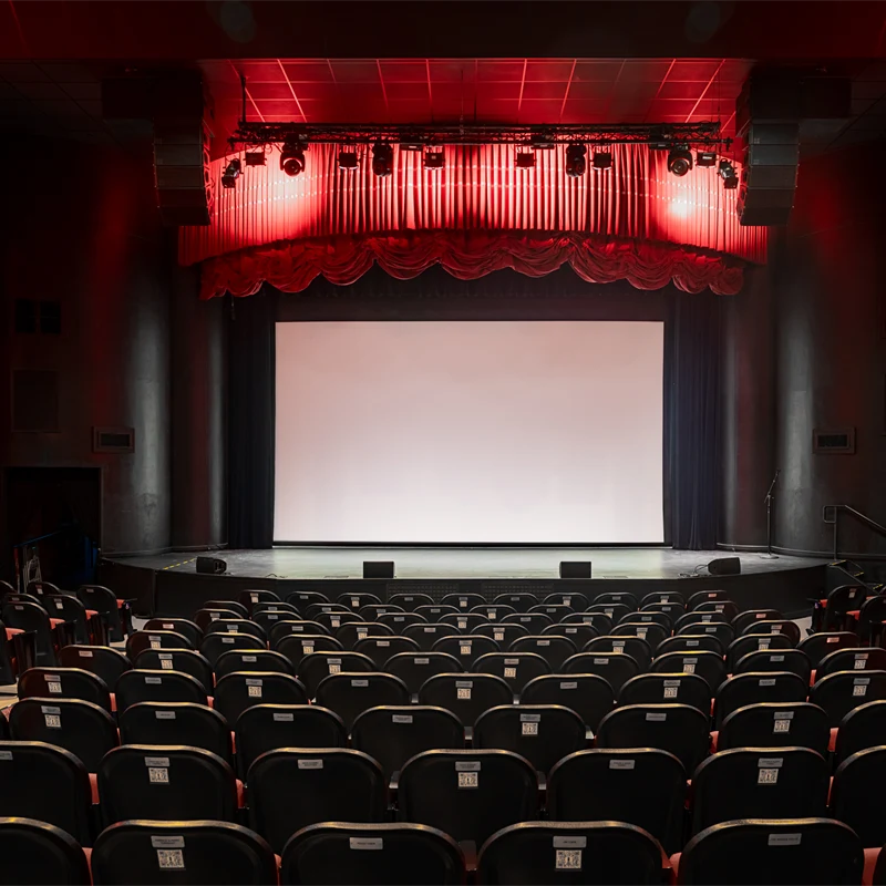 Empty theater with large screen.