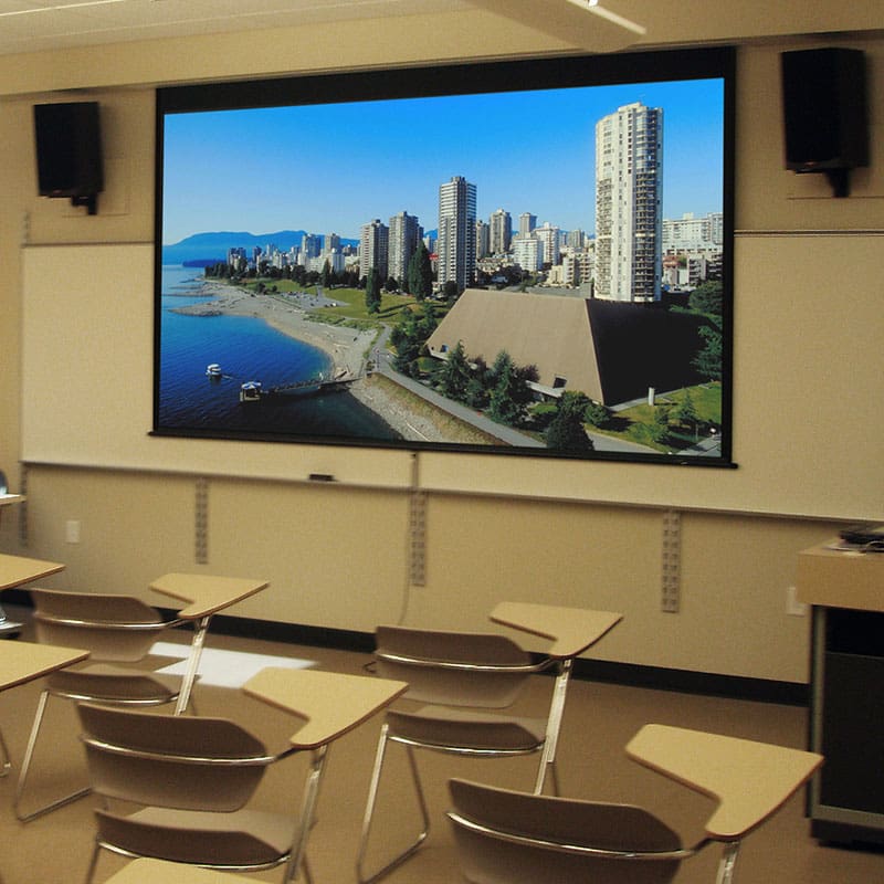 Classroom projector screen showing city skyline.