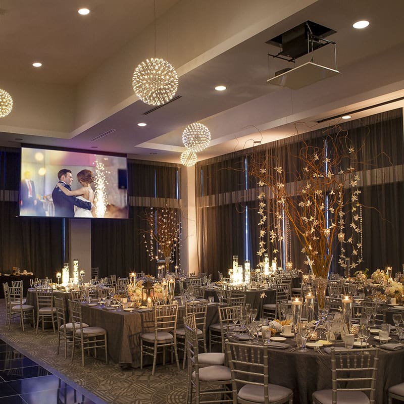 Elegant wedding reception with projector.