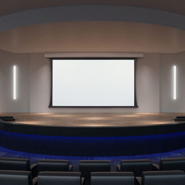 Empty modern theater with large screen.