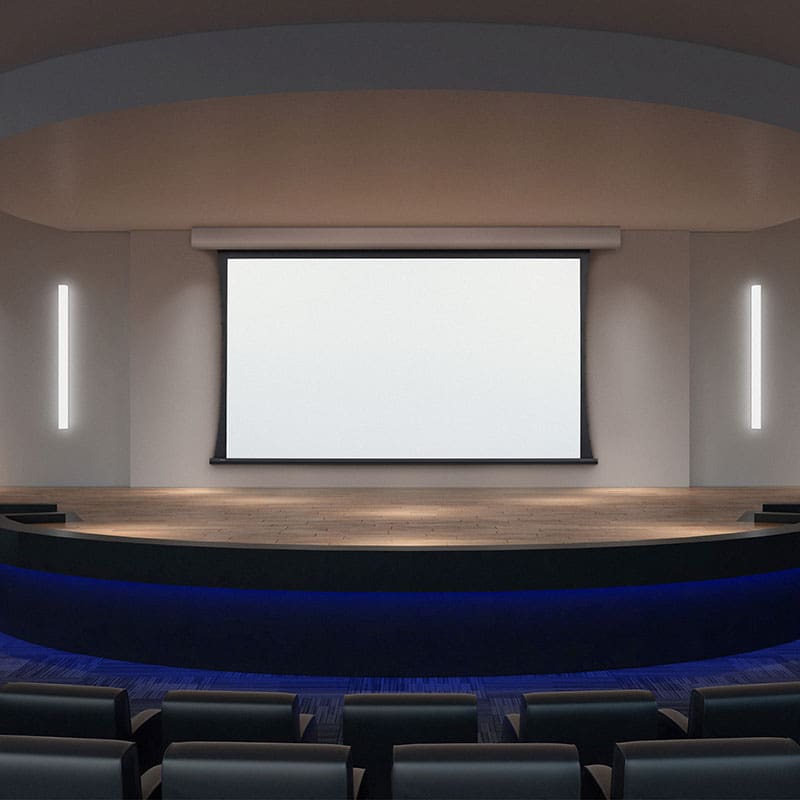 Empty modern theater with large screen.
