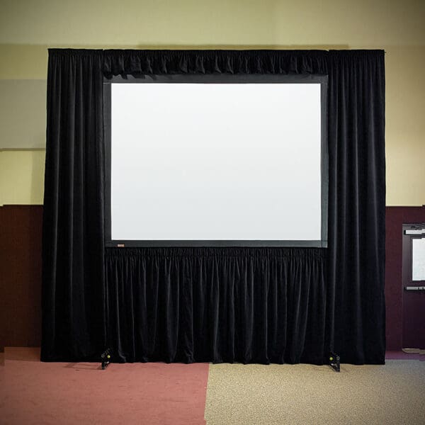 Projection screen with black curtains.