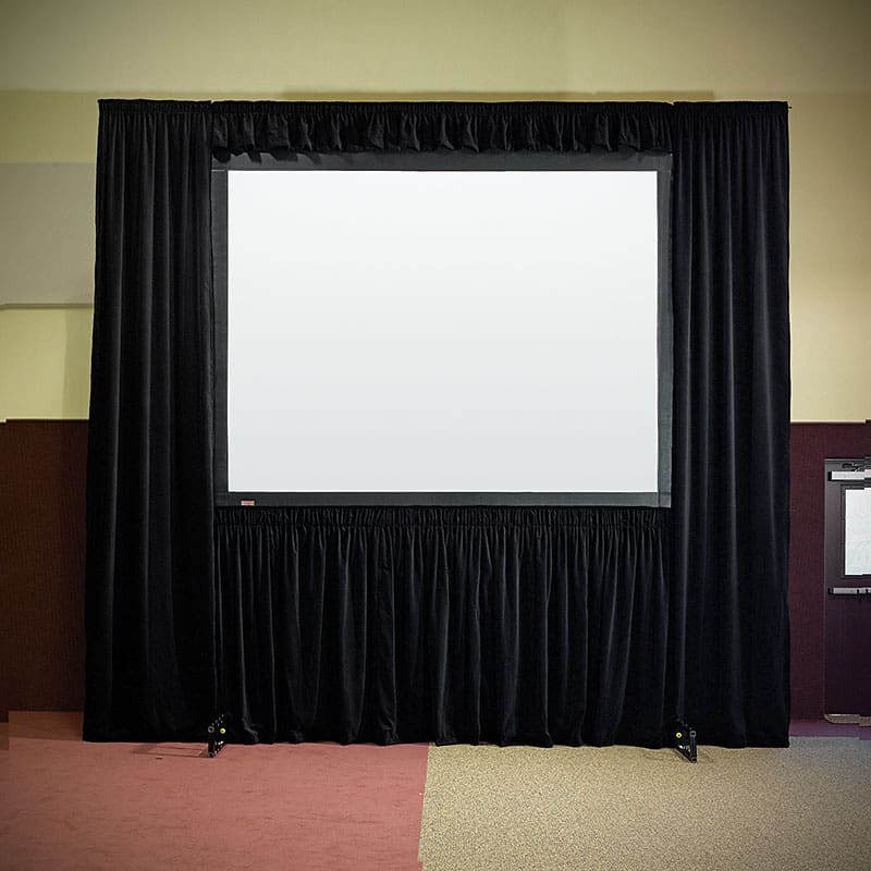 Projection screen with black curtains.