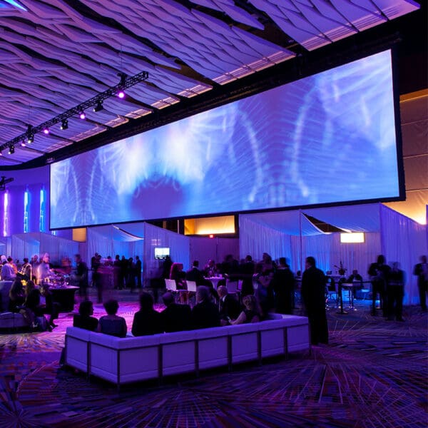 Large screen, event space, purple lighting.
