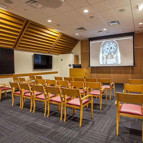 Conference room with projector and chairs.