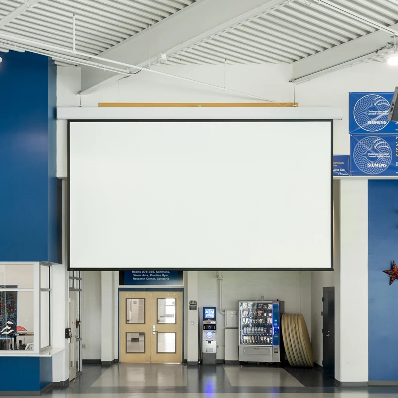 Large blank projection screen in hallway.